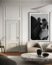 Load image into Gallery viewer, Euphoria Waves by Addison Jones Studio - an elegant interior featuring a black-and-white framed photo of a female surfer, enhancing a modern living room setting.