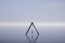 Load image into Gallery viewer, A tranquil image illustrating the artwork 'Beach Wall Decor - Lost Sea Swing 021', featuring a serene swing structure on calm waters, reflecting the beauty of the Salton Sea in California. Ideal for beach-themed interiors.