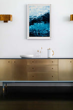 Load image into Gallery viewer, Stylish interior setting featuring a framed Iceland wall art print, showcasing stunning blue and black glacier artwork by Addison Jones Studio, accompanied by elegant home decor.