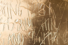 Load image into Gallery viewer, Close-up of 'Let Go' contemporary art piece featuring gold paint and intricate hand-etched text, emphasizing texture and depth.