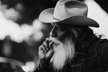 Load image into Gallery viewer, Detailed view of the brushwork in a Contemporary Art Cowboy piece, highlighting the blend of painting techniques and colors to define the subject.