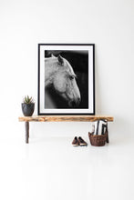 Load image into Gallery viewer, Horse Wall Art displayed elegantly in a modern interior setting, featuring a framed black and white photograph of a horse's head on a rustic wooden bench.