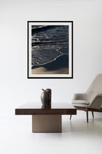 Load image into Gallery viewer, Stylish interior setting featuring Large Wall Art depicting ocean waves framed elegantly above a modern coffee table and chair, enhancing home decor with a serene coastal vibe.