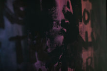 Load image into Gallery viewer, A frontal view of street art with a compelling portrait and layered textures, showcasing the artist's innovative approach to street art.