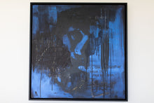 Load image into Gallery viewer, Luxury street art piece titled 'A Face Between the Words,' featuring a striking blue and black color palette with mixed media elements, framed elegantly on a wall.