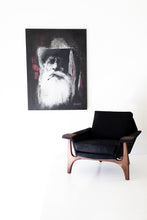 Load image into Gallery viewer, Street Art-Marlbaro Man artwork by Addison Jones hanging above a modern black armchair in a minimalist room.