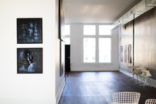 Load image into Gallery viewer, A wide shot of an art gallery wall featuring two framed pieces of street art, including 'Staring Into the Blue,' that highlights its decorative and evocative nature.