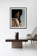 Load image into Gallery viewer, Stylish living room featuring a framed 'Tightly Curled' wall art print above a modern coffee table, highlighting contemporary interior design.