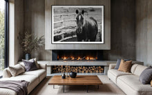Load image into Gallery viewer, Elegant interior featuring a framed black and white photograph of a horse, titled &#39;Limited Edition Horse Pictures - Morose Molly 0211 by Addison Jones Studio&#39;, hanging above a modern fireplace and cozy seating.
